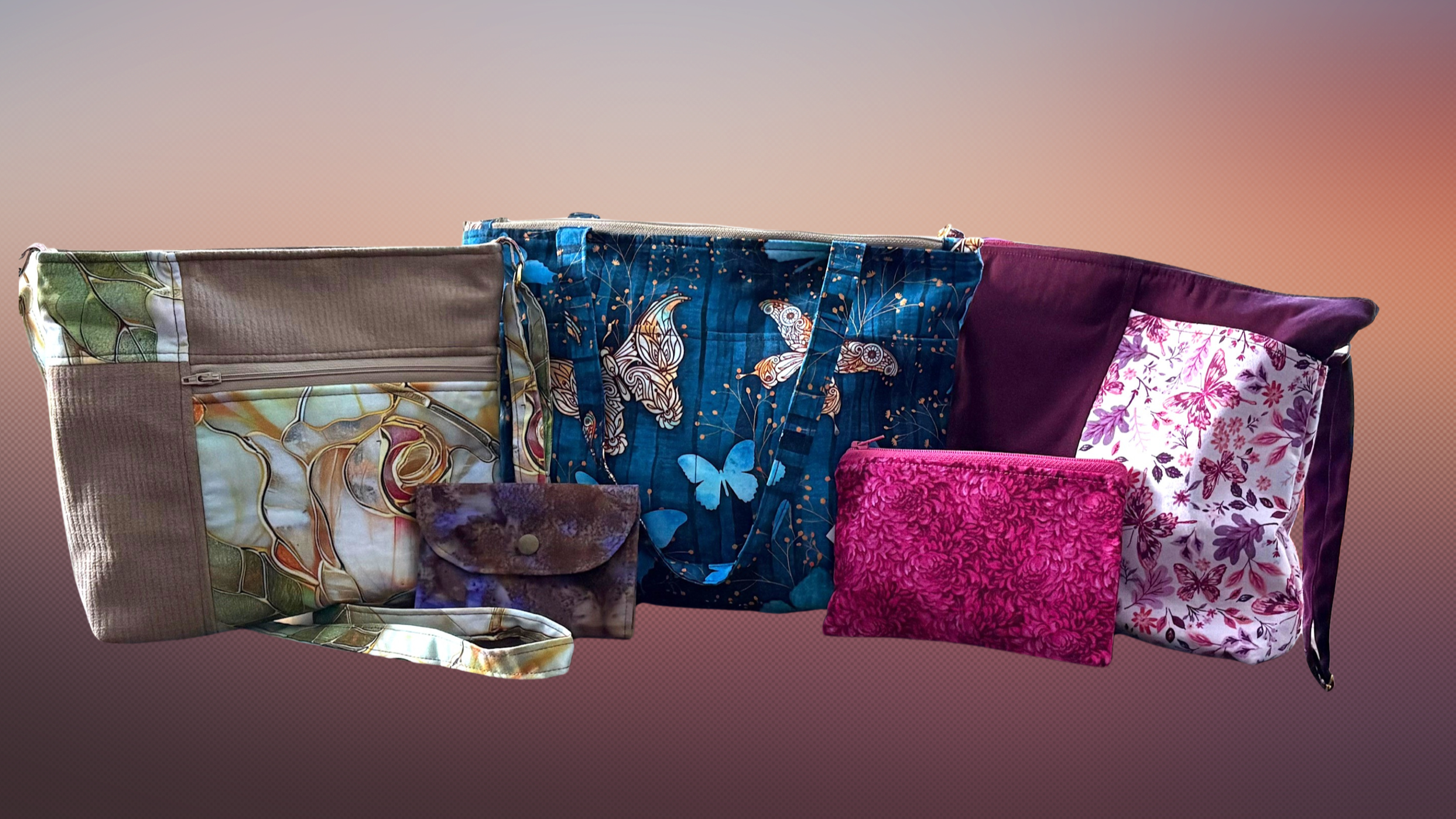 A collection of colorful, patterned bags and pouches arranged in a row